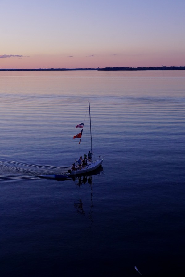Sailboat on Lake Mendota at dusk